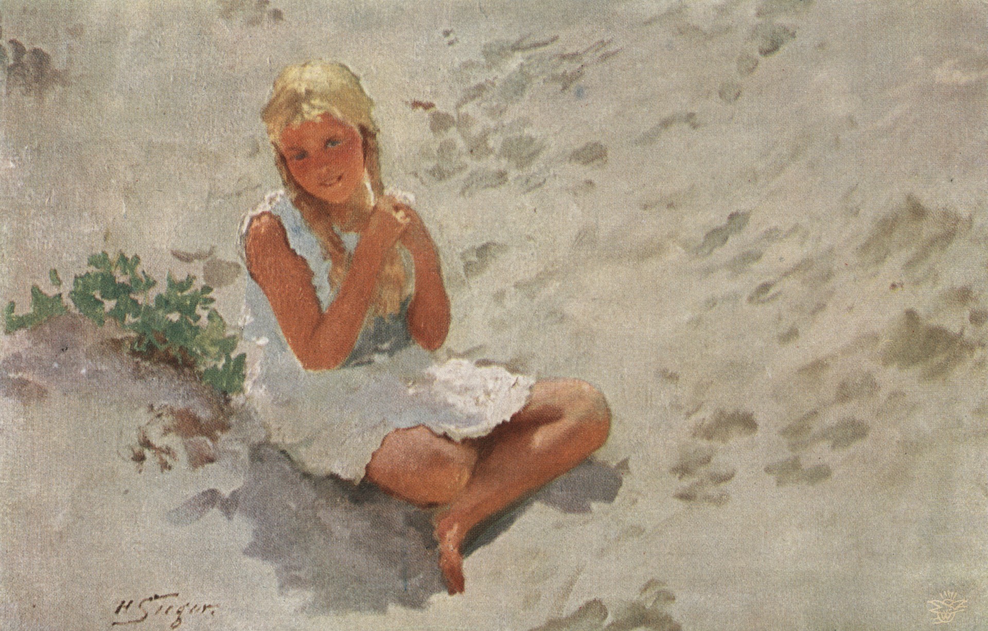 Девочка сидит на песке